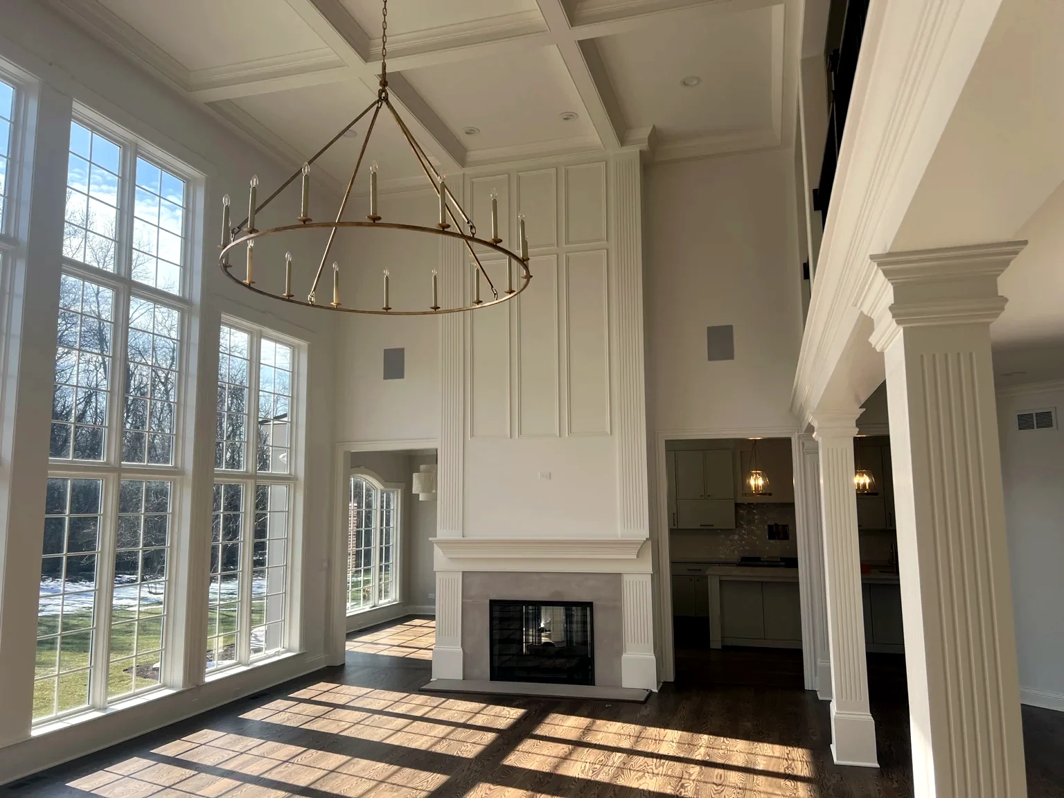 Fireplace millwork and coffered ceiling