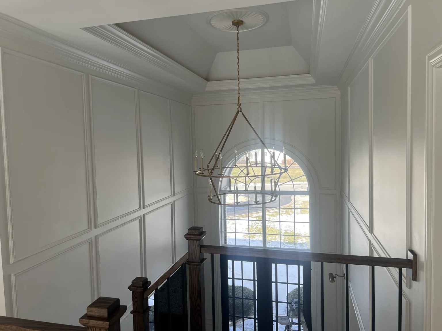 Stair hall with wainscoting and applied wall moulding